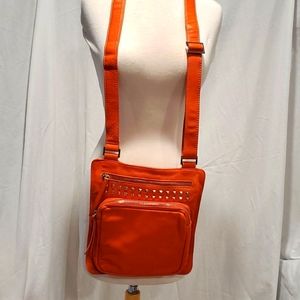 Genuine orange leather crossbody purse w silver colorr accessory.